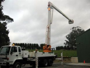 Drouin Tree Services cherry picker extended to reach tree top