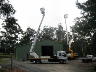 Two of Drouin Tree Services cherry pickers for hire